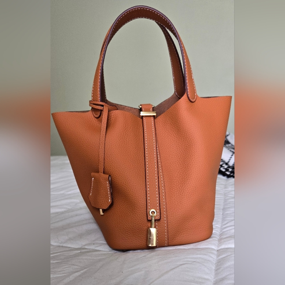 Tan Hobo Bag with Gold Hardware and Structured Design